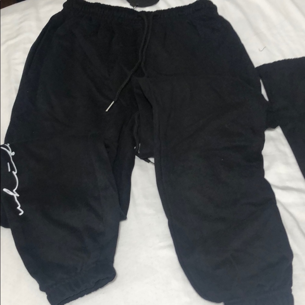 Black sweatpants, with white lettering, never worn